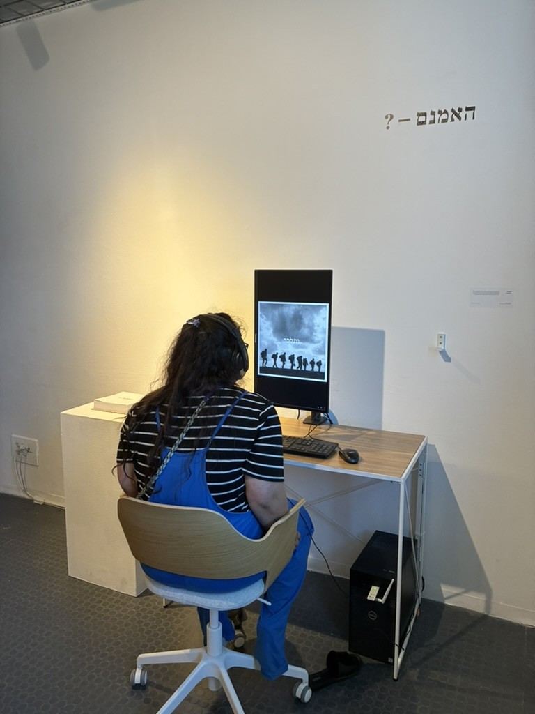 A visitor watching the film her composition became.